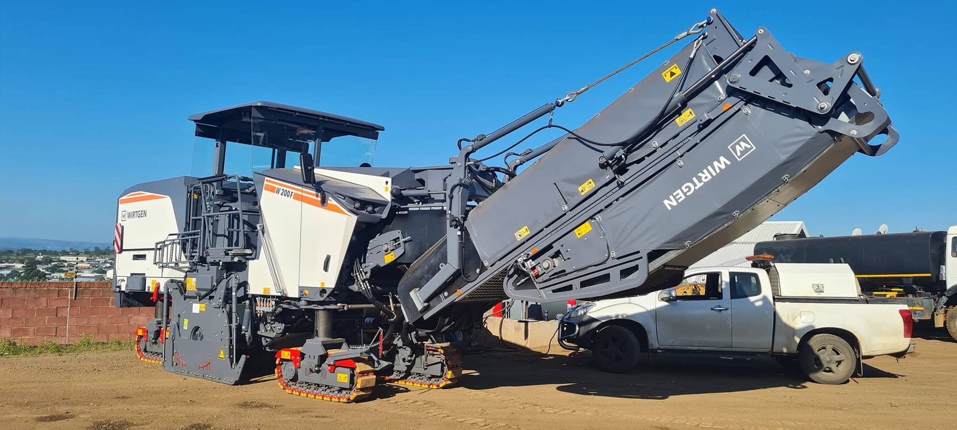 Roller compacting a new asphalt surface